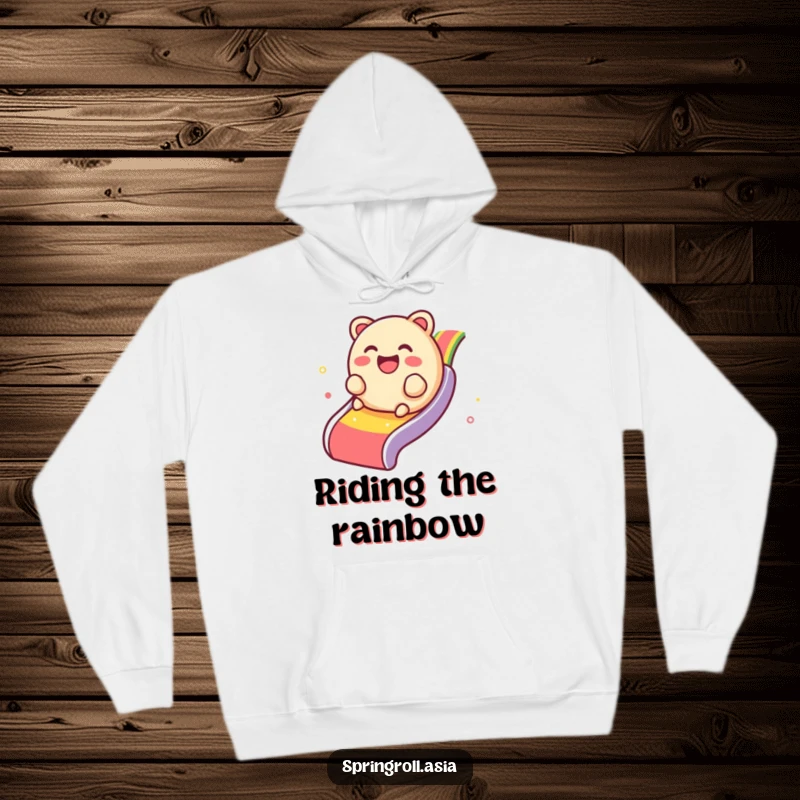 Funny hoodie featuring a giggling dim sum dumpling rolling down a bright rainbow slide, cozy and full of cheer.