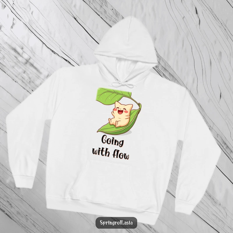 Funny hoodie featuring a laughing gyoza dumpling taking a thrilling ride downhill on a big green leaf, cozy and fun.